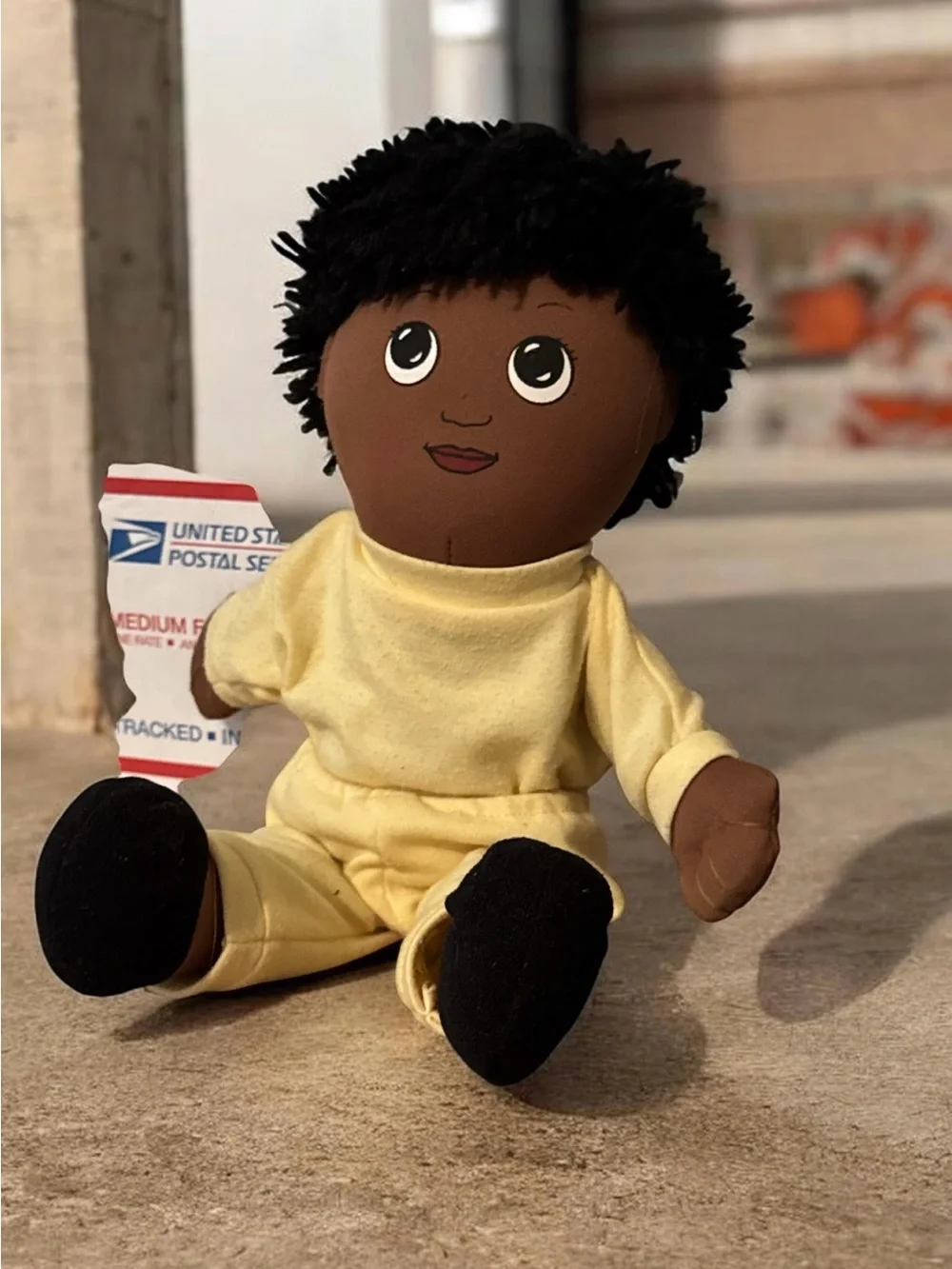 Plush Baby Doll in Yellow Outfit with Black Yarn Hair